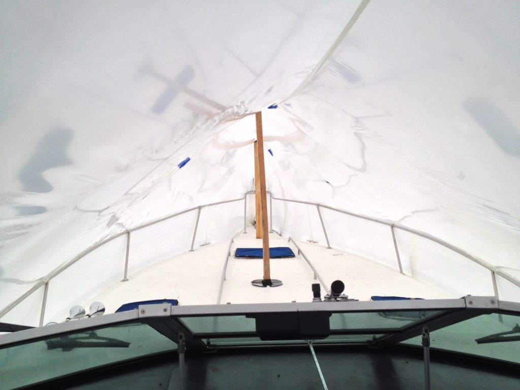 inside sailboat shrink wrapped