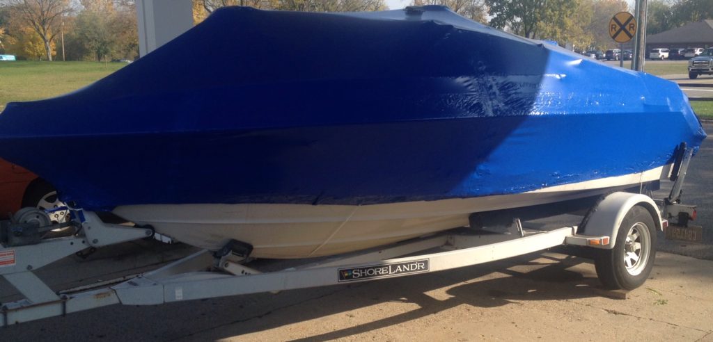 speed boat shrink wrapped for winter